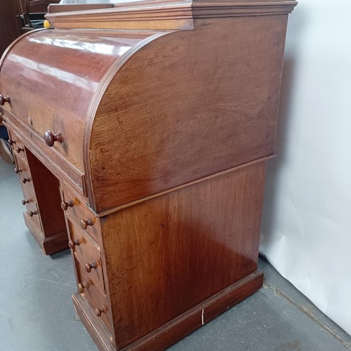 106 - A 19th century mahogany cylinder front bureau, 119 cm wide