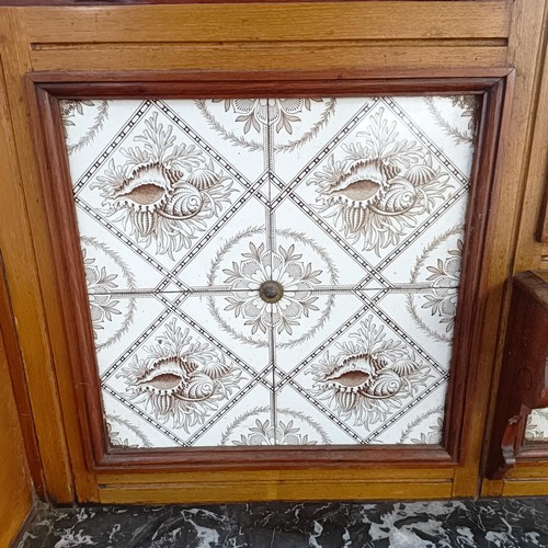 110 - An early 20th century walnut washstand, with a raised tile and mirrored back, on a base with a marbl... 