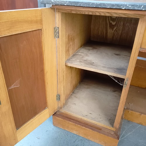 110 - An early 20th century walnut washstand, with a raised tile and mirrored back, on a base with a marbl... 