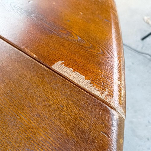 115 - An 18th century style oak gateleg dining table, on bobbin turned legs, 203 cm wide