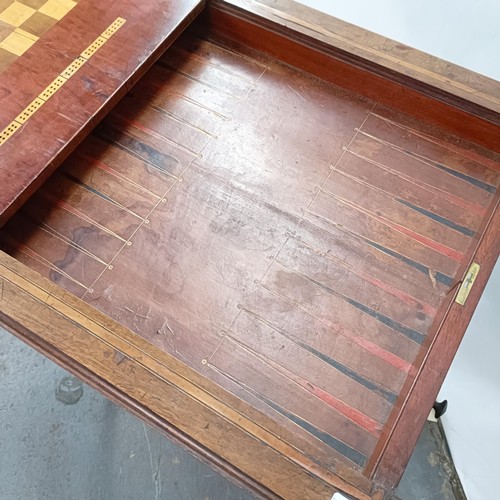 120 - A 19th century mahogany games table, with reversible top, 60 cm wide