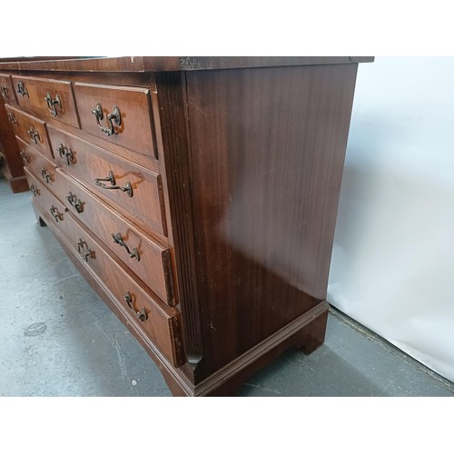 122 - A George III style mahogany chest, having nine drawers, 153 cm wide.