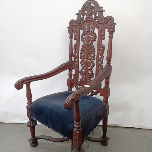 124 - A late 19th century oak armchair, with carved back, 130 cm high