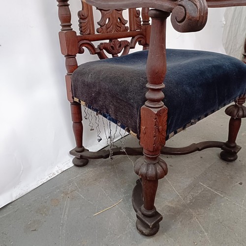 124 - A late 19th century oak armchair, with carved back, 130 cm high