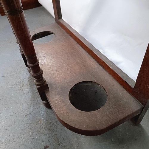 126 - An Edwardian mahogany hall stand, inset with two tiles, 81 cm wide