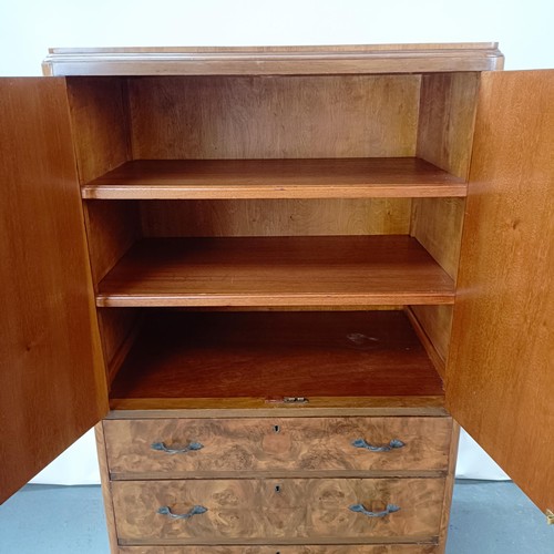 129 - An Art Deco burr walnut gentleman's wardrobe, 74 cm wide