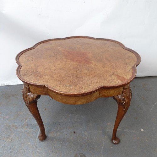 130 - A burr walnut coffee table, 65 cm wide