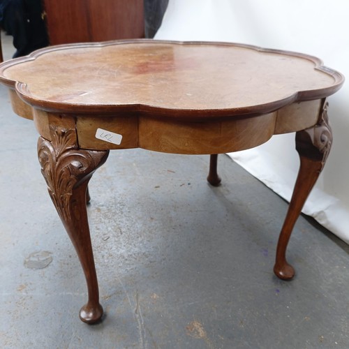 130 - A burr walnut coffee table, 65 cm wide