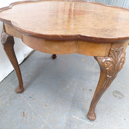 130 - A burr walnut coffee table, 65 cm wide