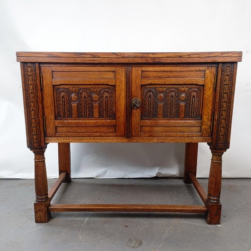 139 - A 17th century style oak cabinet, with carved decoration, 92 cm wide