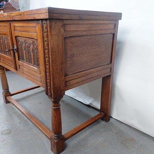 139 - A 17th century style oak cabinet, with carved decoration, 92 cm wide