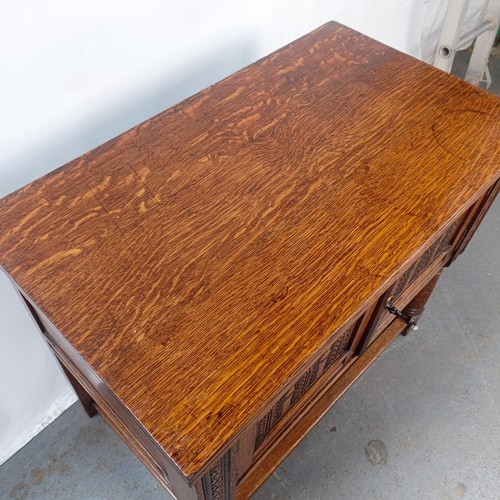 139 - A 17th century style oak cabinet, with carved decoration, 92 cm wide