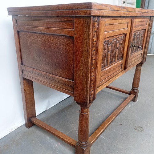 139 - A 17th century style oak cabinet, with carved decoration, 92 cm wide