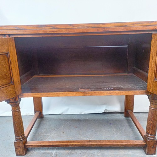 139 - A 17th century style oak cabinet, with carved decoration, 92 cm wide