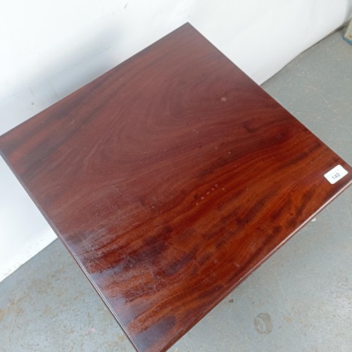 140 - A mahogany two tier lamp table, 48 cm wide