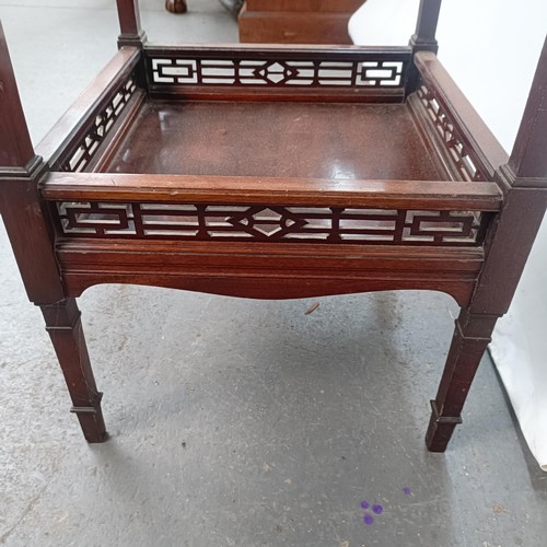 140 - A mahogany two tier lamp table, 48 cm wide