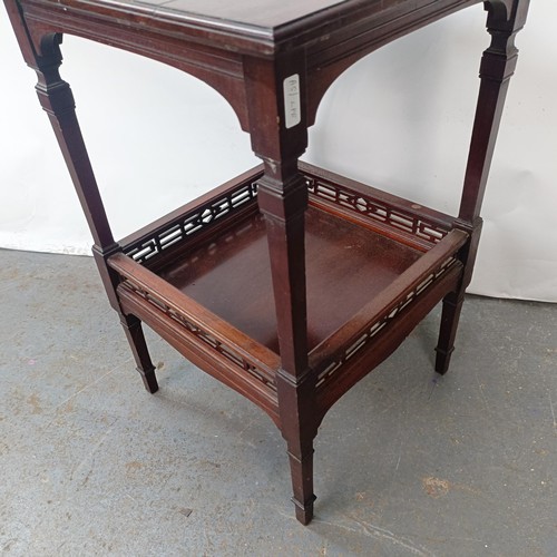 140 - A mahogany two tier lamp table, 48 cm wide