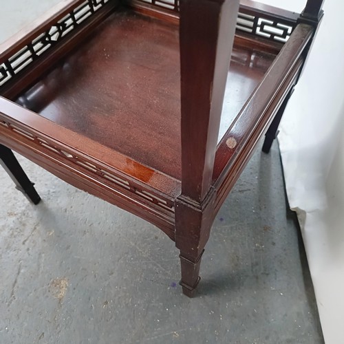 140 - A mahogany two tier lamp table, 48 cm wide