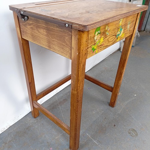 141 - An oak school desk, 56 cm wide