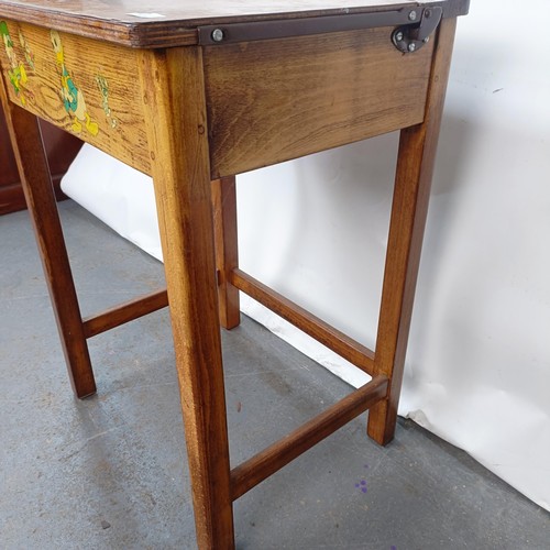 141 - An oak school desk, 56 cm wide