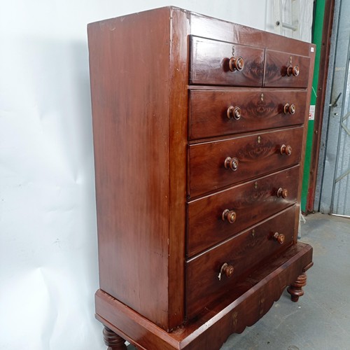 142 - A Victorian mahogany chest, of two short and four long drawers, on a base with turned feet, 128 cm w... 