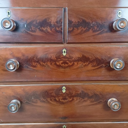 142 - A Victorian mahogany chest, of two short and four long drawers, on a base with turned feet, 128 cm w... 