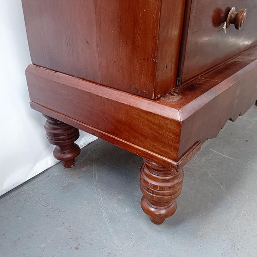 142 - A Victorian mahogany chest, of two short and four long drawers, on a base with turned feet, 128 cm w... 