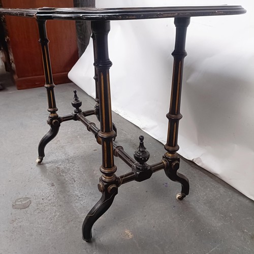 143 - A late 19th century ebonised side table, 82 cm wide