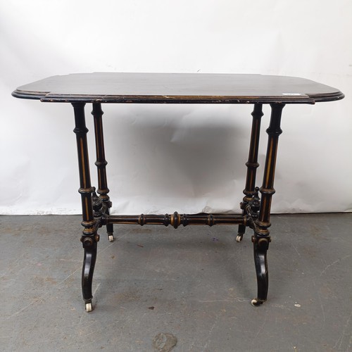 143 - A late 19th century ebonised side table, 82 cm wide