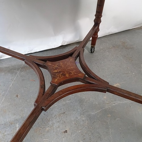 144 - An Edwardian walnut lamp table, 100 cm wide