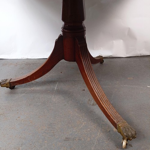 147 - A Victorian mahogany breakfast table, with a column support to a tripod base, 131 cm wide