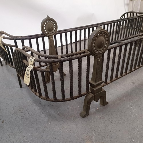 148 - An unusual pair of Aesthetic Period iron and brass fenders, 153 cm wide (2)