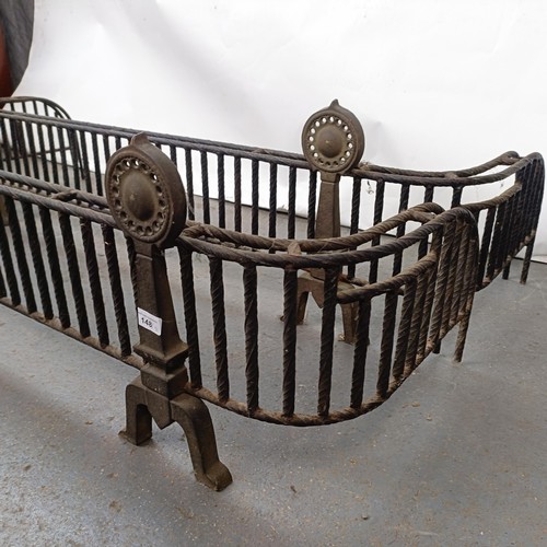 148 - An unusual pair of Aesthetic Period iron and brass fenders, 153 cm wide (2)