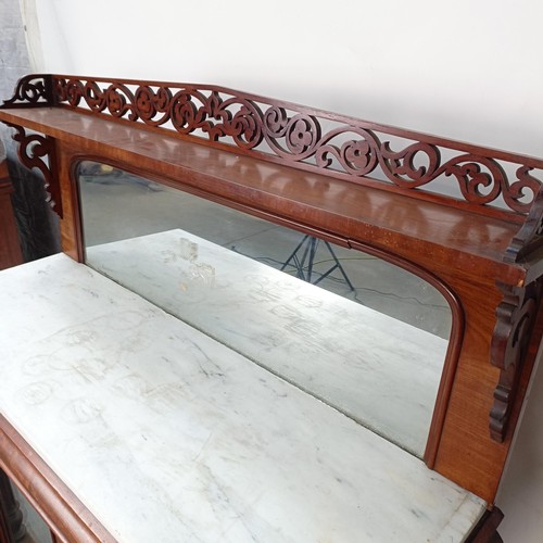 153 - A Victorian mahogany chiffonier with a mirrored back, the base with a marble top, and two mirrored c... 