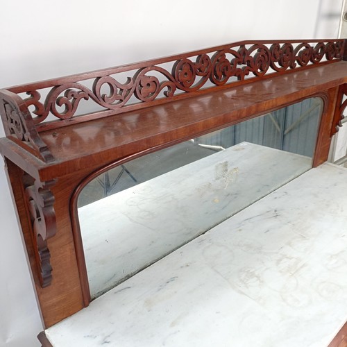 153 - A Victorian mahogany chiffonier with a mirrored back, the base with a marble top, and two mirrored c... 