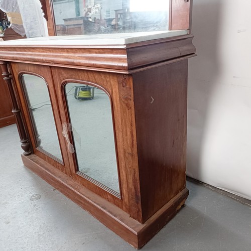 153 - A Victorian mahogany chiffonier with a mirrored back, the base with a marble top, and two mirrored c... 