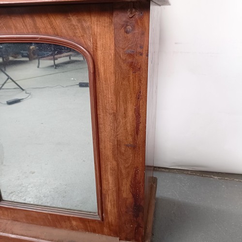 153 - A Victorian mahogany chiffonier with a mirrored back, the base with a marble top, and two mirrored c... 