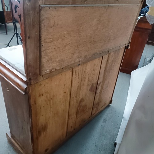 153 - A Victorian mahogany chiffonier with a mirrored back, the base with a marble top, and two mirrored c... 