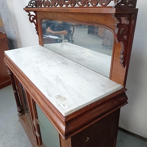 153 - A Victorian mahogany chiffonier with a mirrored back, the base with a marble top, and two mirrored c... 