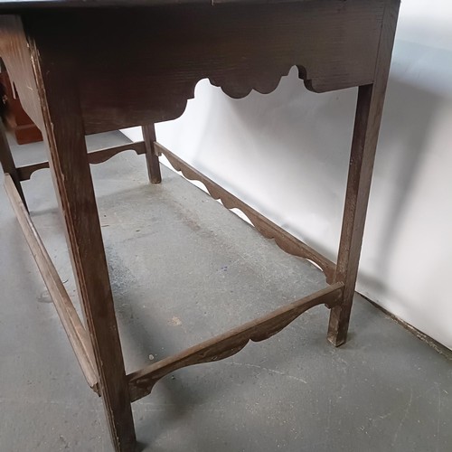 154 - An 18th century style oak table, 138 cm wide