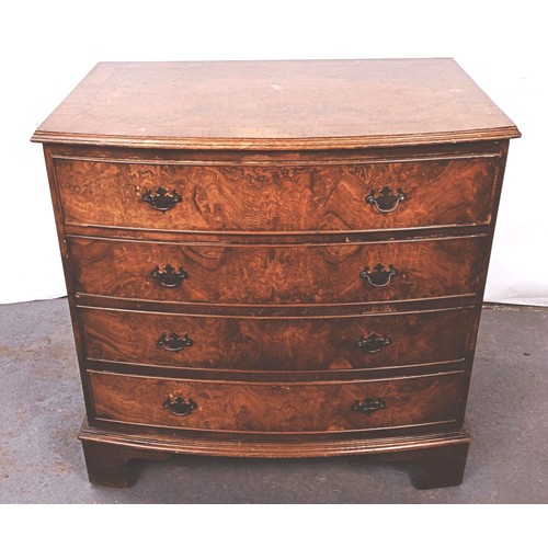 251 - A George III style walnut bow front chest, having four drawers