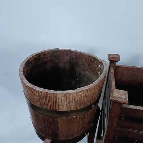 247 - An oak and brass bound planter, 88 cm high, and two others (3)