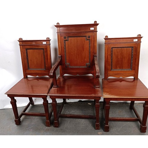 246 - A mahogany armchair, with a panel back and seat, and a matching pair of single chairs (3)