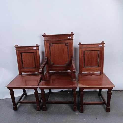 246 - A mahogany armchair, with a panel back and seat, and a matching pair of single chairs (3)