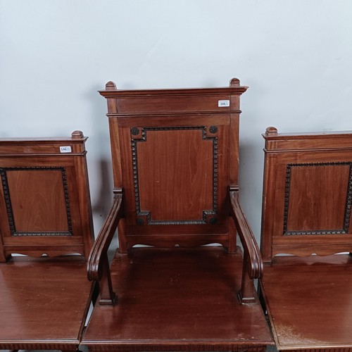 246 - A mahogany armchair, with a panel back and seat, and a matching pair of single chairs (3)