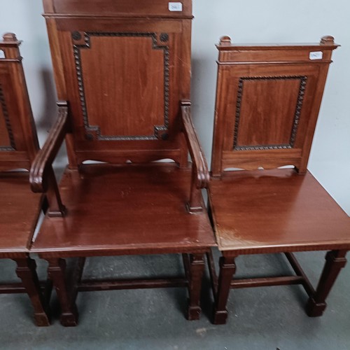 246 - A mahogany armchair, with a panel back and seat, and a matching pair of single chairs (3)