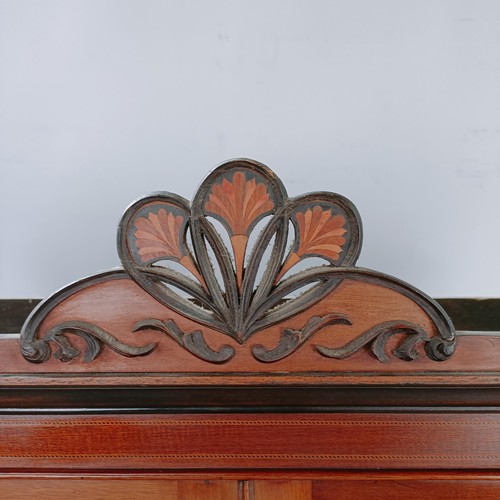 157 - An early 20th century mahogany display cabinet, with two glazed doors above two drawers on cabriole ... 