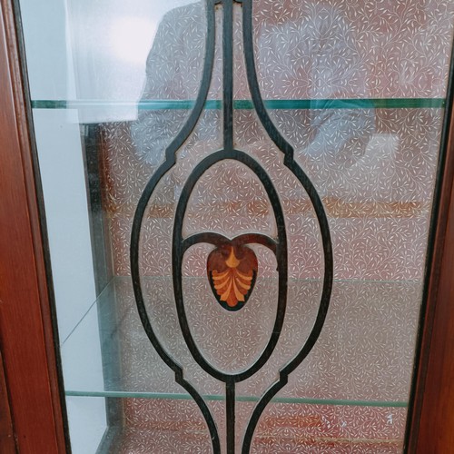 157 - An early 20th century mahogany display cabinet, with two glazed doors above two drawers on cabriole ... 