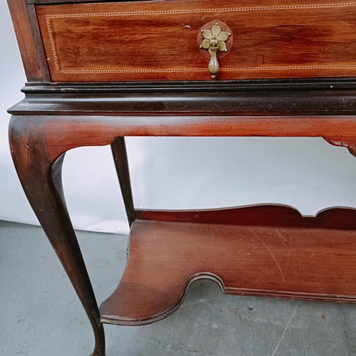 157 - An early 20th century mahogany display cabinet, with two glazed doors above two drawers on cabriole ... 