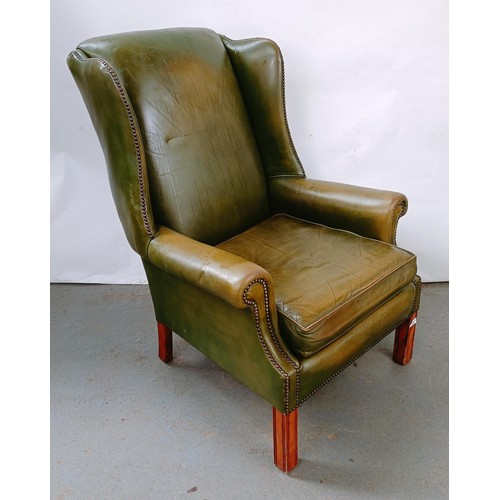 159 - A George III style wingback armchair